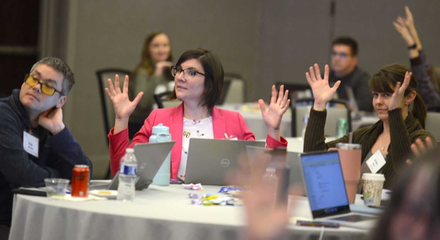 Educators at round table participating in a workshop