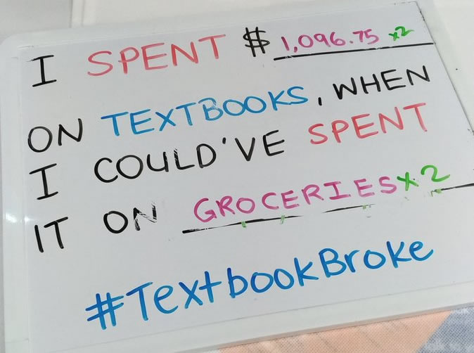 Whiteboard with "I spent $ on textbooks" when I could have spent it on food.