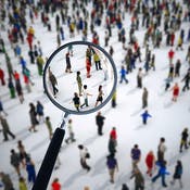 group of people from a distance with a magnifying glass over the center of the group